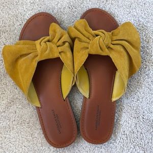 Gently worn mustard bow slide sandals